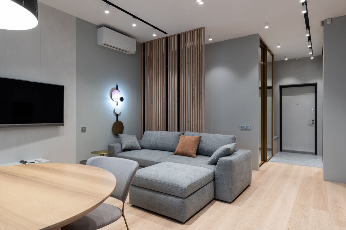 Modern living room with a wall-mounted mini split indoor unit, one of the two heads the best 2 zone DIY mini split runs from a single outdoor condenser